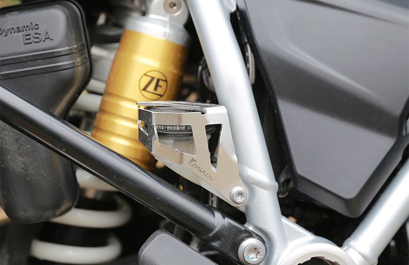 Rear brake fluid cup protection