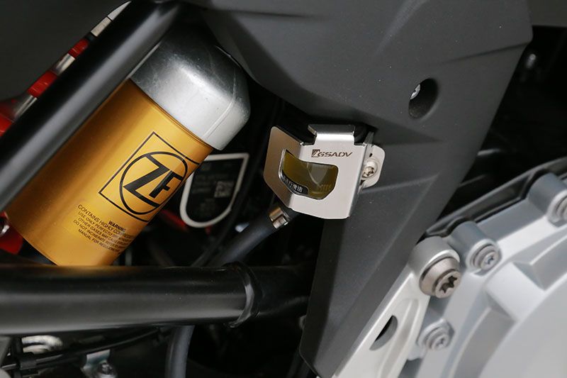 Rear brake fluid cup protection