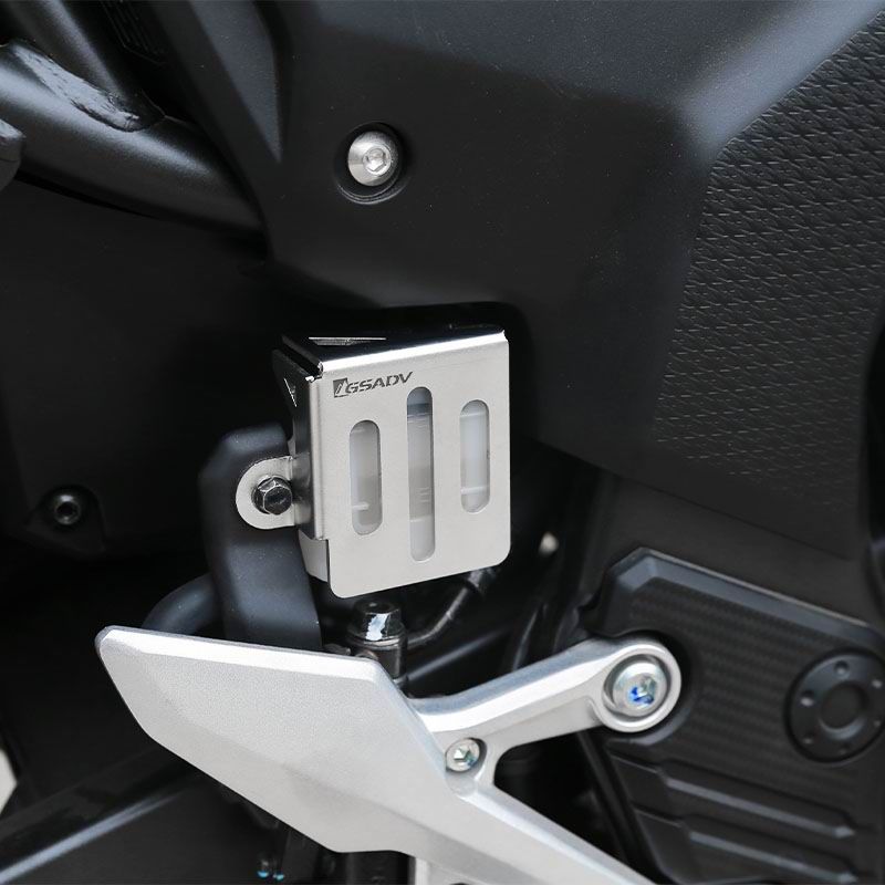 Rear brake fluid cup protection